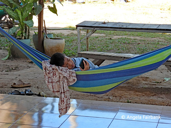 boy in hammock at our lunch place