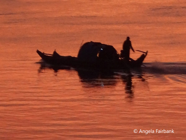 silhouette of boat at sunset on the Mekong 3