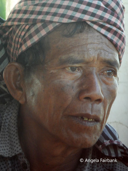 Cambodian man in head scarf