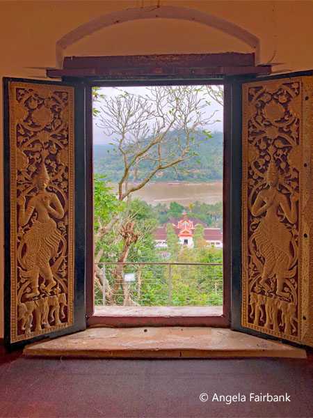 view out the window of a temple at the Chomsi Stupa
