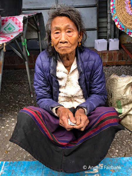 elderly woman at morning market
