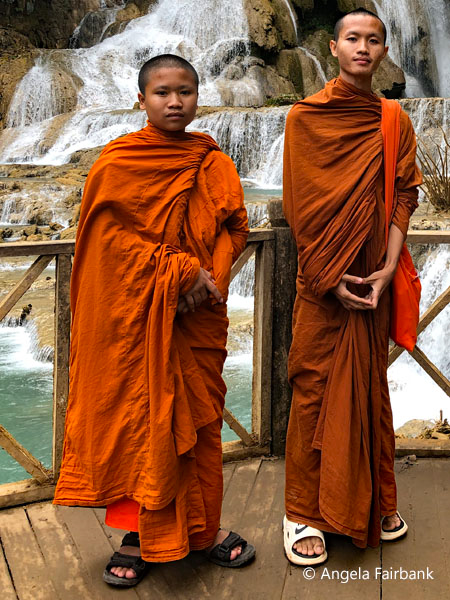 two monks at falls