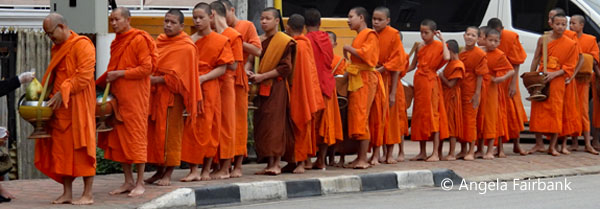 line of monks reciving alms 