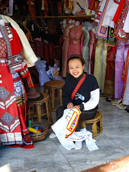 hill tribe woman embroidering