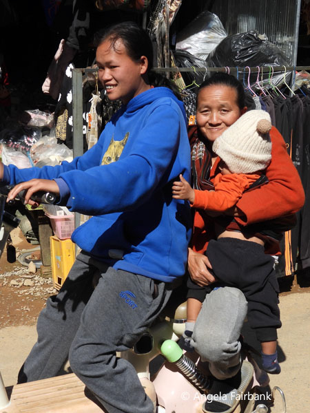 family of 3 on motorbike