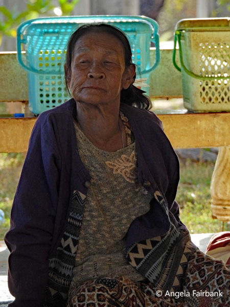 old woman sitting