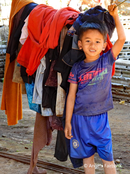 boy with clothes on line
