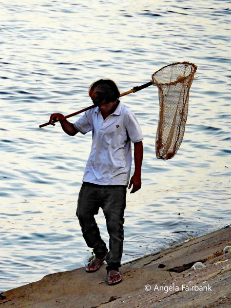 fisherman on the Mekong with a net