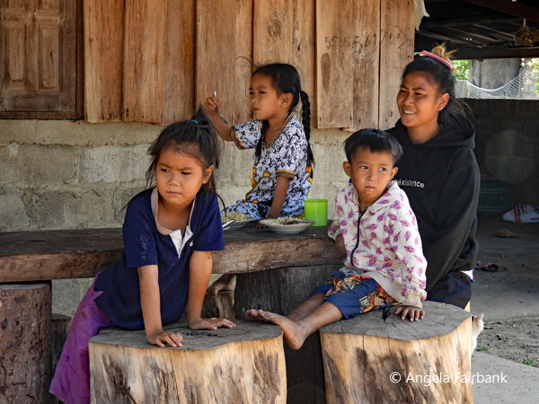 mother and children in village