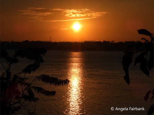 sun setting over Mekong River and Thailand 