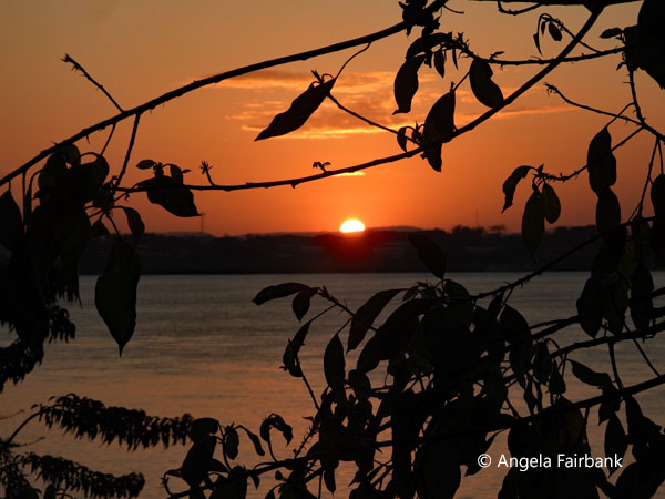 sun setting over Mekong River and Thailand 2