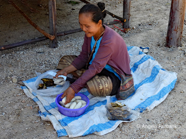 woman cutting up root vegetables