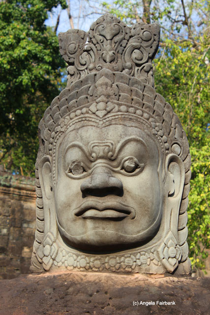 Stone head on bridge toward Bayon 3