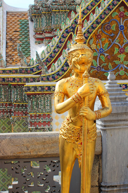 gold statue in Wat Phra Kaeo temple complex
