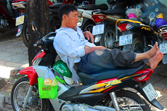 man resting on skooter