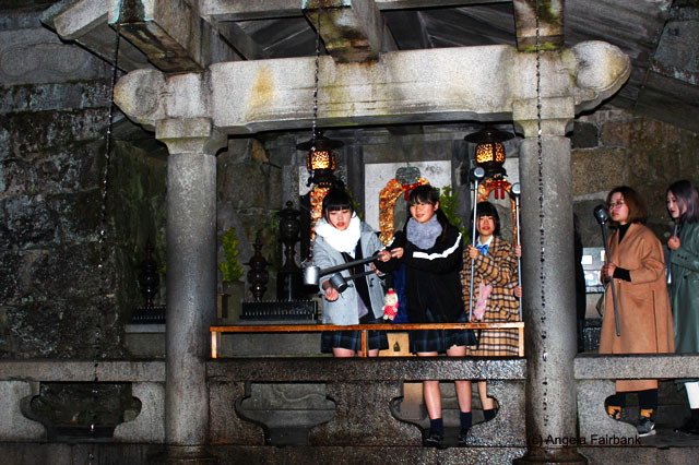 young women trying their luck at Kiyomizu Temple