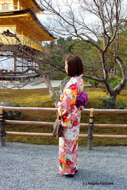older women in traditional dress at Golden Pavilion