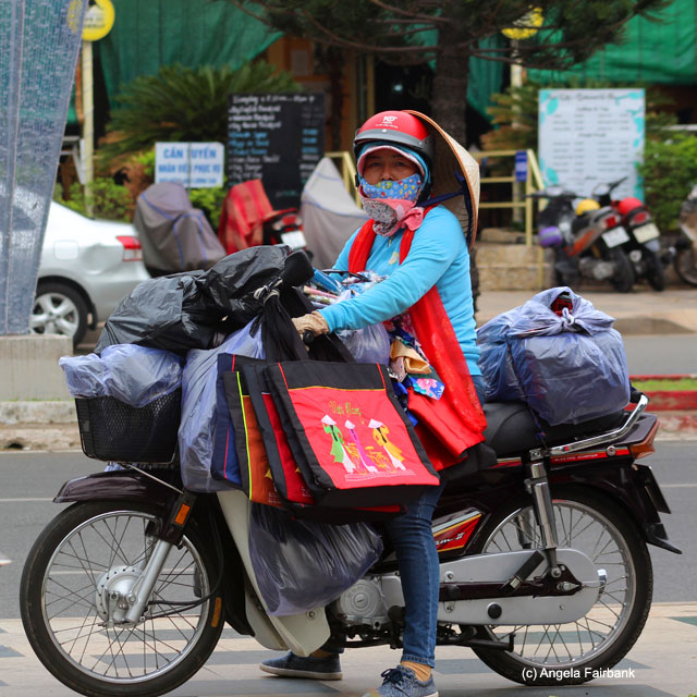 stalking souvenir vendor on scooter