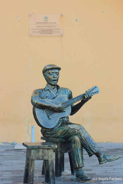 statue of singer with guitar