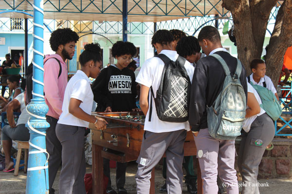 secondary school students playing foosball