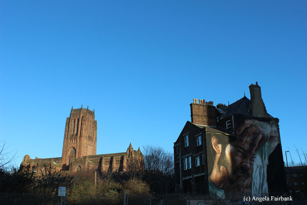 cathedral and house with graffiti wall