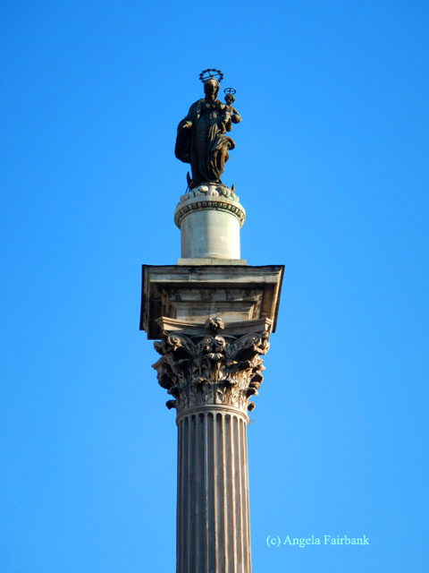 santa maria and Christ child on column outside church