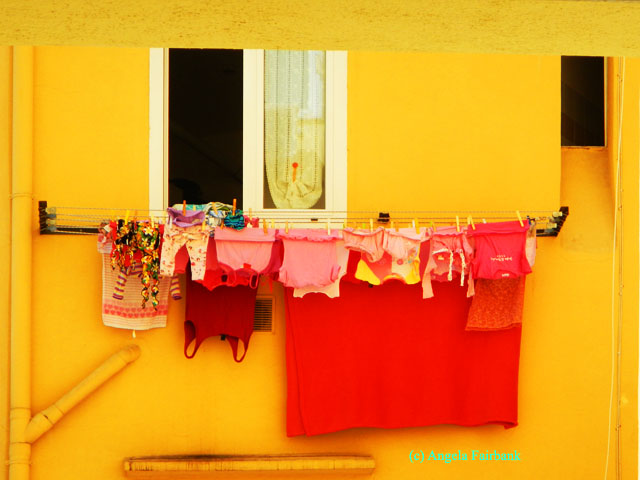 red washing on yellow wall