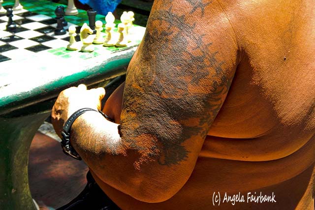 Chess player with tattoo, Papeete, Tahiti, French Polynesia, copyright Angela Fairbank