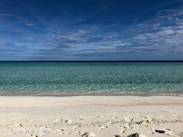 stripes of sand sea and sky