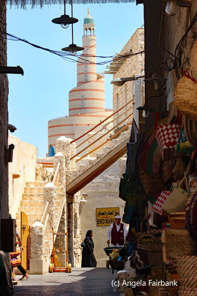 souk scene with mosque