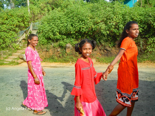 three generations of women near hindu temple