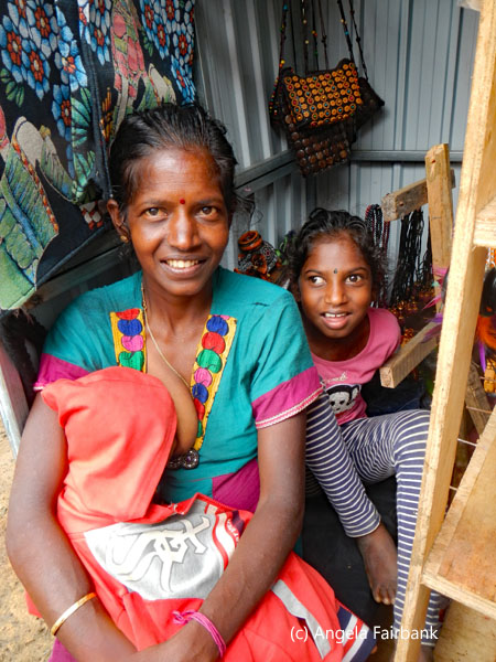 mother with two children in souvenir booth