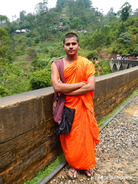 monk on railway tracks