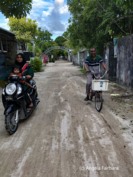 main street with motorbike and bicycle