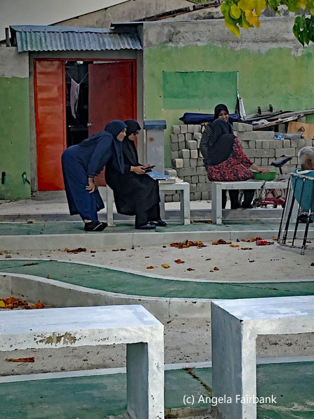 woman sitting and talking