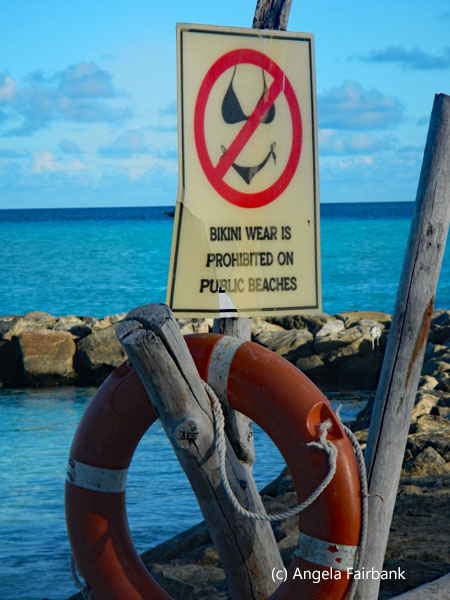no bikinis on public beach sign