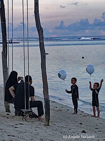 famly photographing at beach