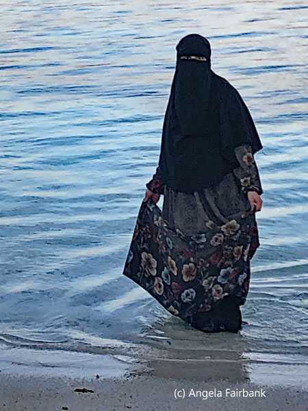 muslim woman in water