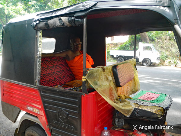 monk in tuktuk
