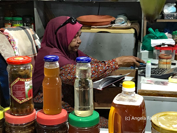 woman vendor in fruit and vegetable market
