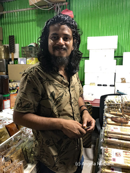 vendor at fruit and vegetable market