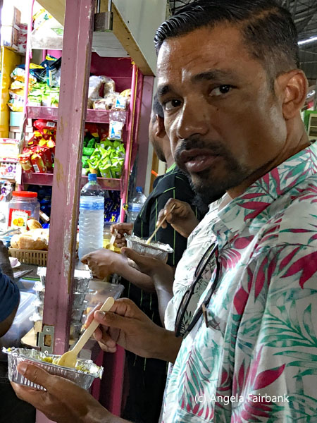 man at food stall