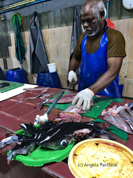 man fileting fish