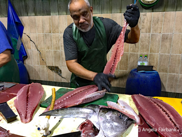 man fileting fish