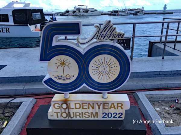 50 years of tourism sign