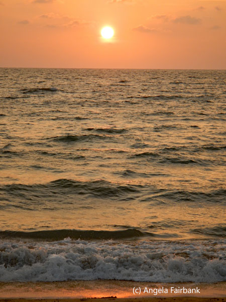 sun setting over water 1