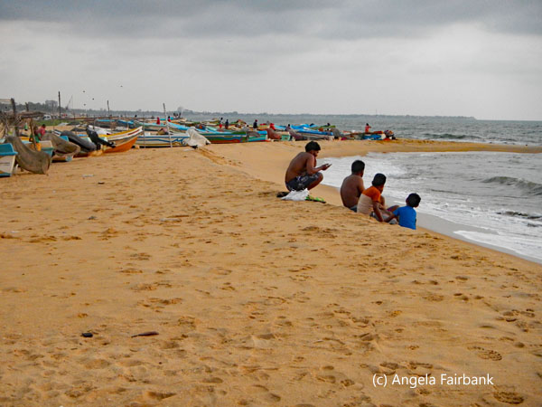 boys sitting on beach 1
