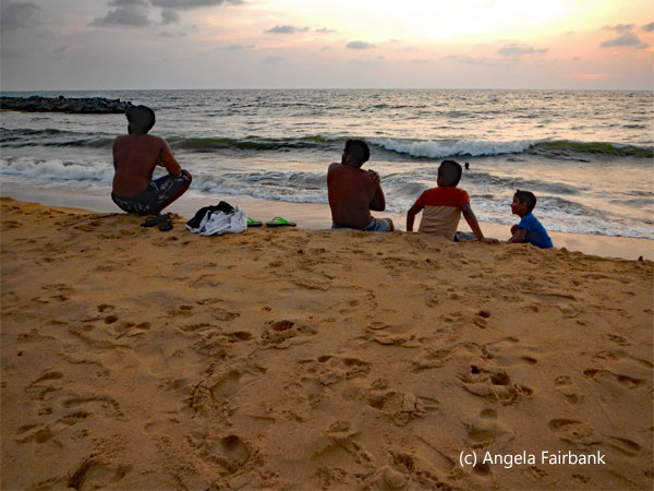 boys sitting on beach 2