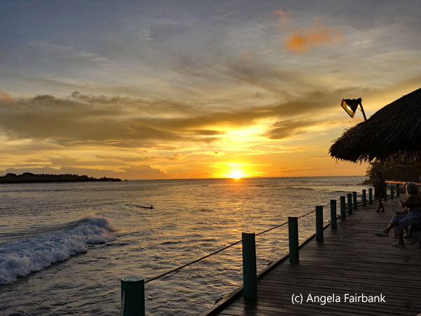 sunset at surfing beach with building