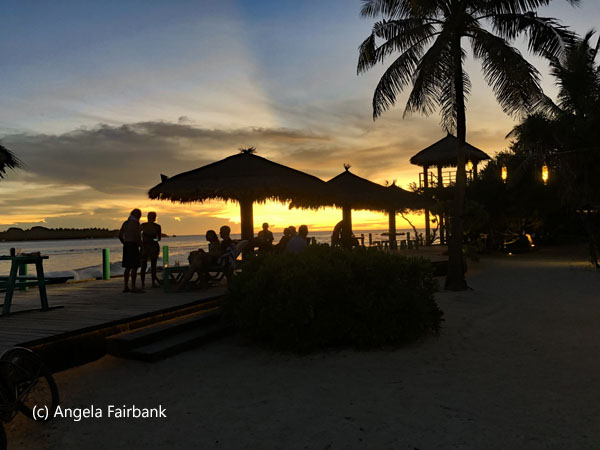 sunset with umbrellas and silhouettes